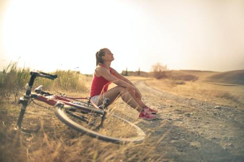 girlslovingbikes:girl in red with a red bike