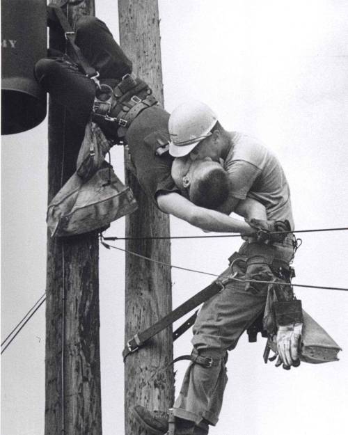 historicaltimes:  “The Kiss of Life” shows a utility worker named J.D. Thompson giving m