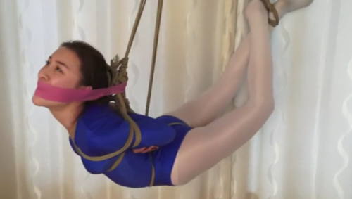 Cute Asian Ballerina Hogtied And Lifted Off The Ground This beautiful Asian dancer is very flexible.