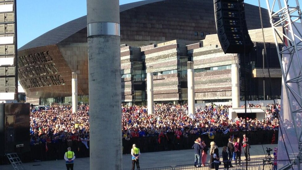 blue-madness-blue:  Cardiff City fans cheer their team on a day of sunshine celebrations