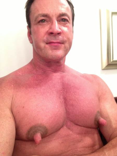 He is one very handsome man and with exceptional pecs and awesome nips!  WOOF