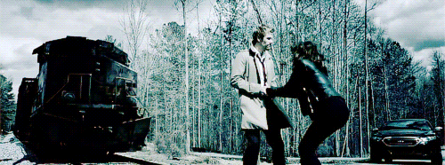 thelaughingmagician:  I’m the one who steps from the shadows, all trenchcoat and cigarette and arrogance, ready to deal with the madness. [x] 