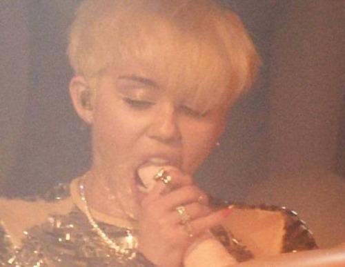 Miley Cyrus blowing a doll. More please! adult photos