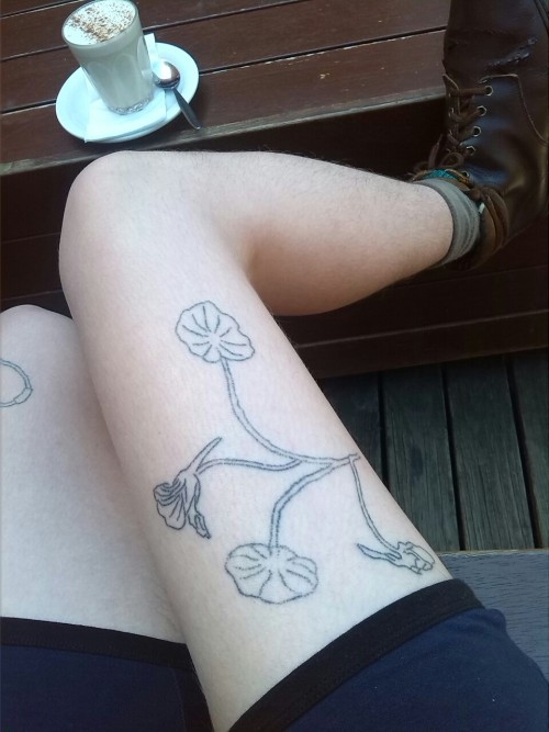fingersandfelines:Having a chai latte between appointments. Admiring my nasturtiums.