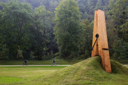 portu666:  Photograph by mmarsupilami on Flickr This wonderful outdoor art sculpture by Turkish artist Mehmet Ali Uysal shows a giant clothespin pinching the grass. It was built for the Festival of the Five Seasons in Chaudfontaine Park, located on the