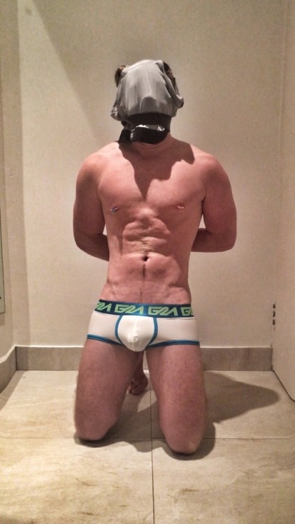 tightlypacked:  Boy forced to wear my boxers as a hood for a while. Kneeling, and straining in the urethral cage.