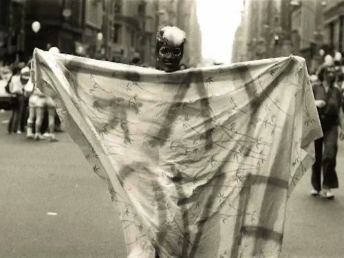 funkpunkandroll84:Marsha P. Johnson at a Christopher Street Liberation rally with a curtain that has