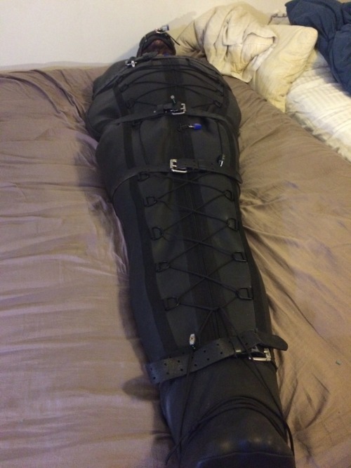 rbrlover:  Spent 7 hours padlocked inside my sleepsack locked in my holy trainer. Courtesy of Dogcat