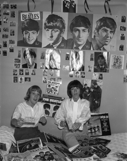 Beatles fans with their merchandise and tickets