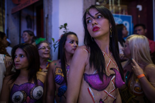 Porn Pics Topless and body painted at a Brazilian carnival,