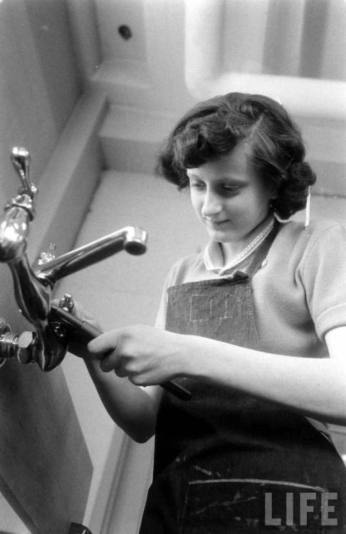 Learning to fix a faucet in industrial arts class in Jersey City(Ralph Morse. n.d.)