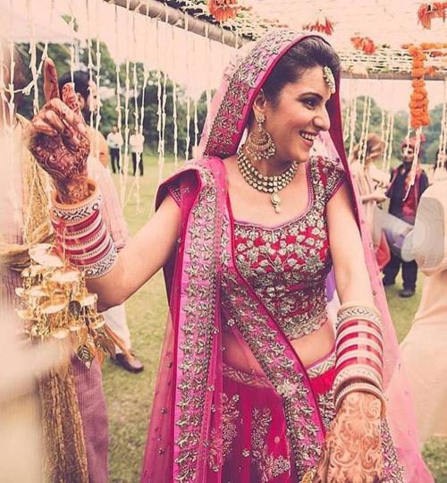 Just how lovely does this bride look in a deep red and pink lehenga on her big day!  #TheARBride ✨ @