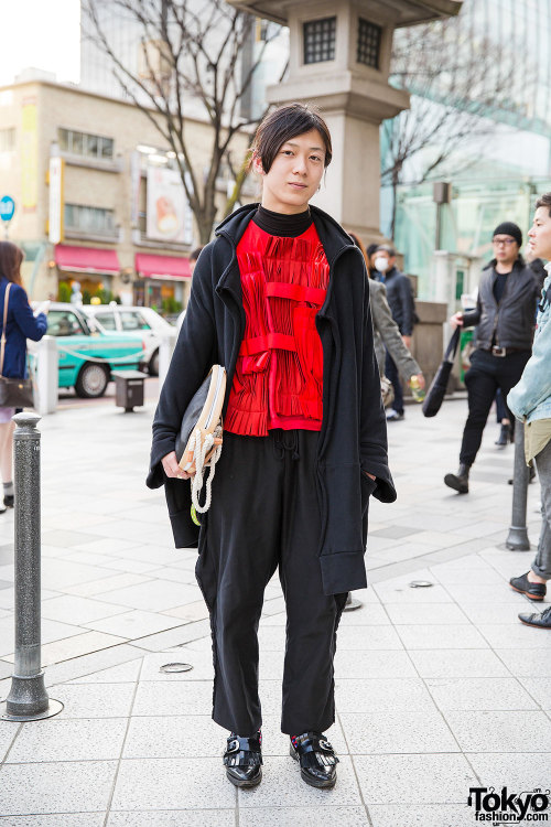 20-year-old Shuntano on the street in Harajuku wearing a red Comme Des Garcons top under a Limi Feu 