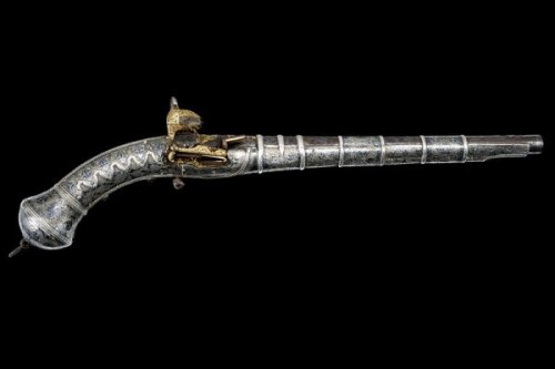 A finely engraved gold and silver decorated Cossack&rsquo;s pistol, early 19th century.Estimated Val