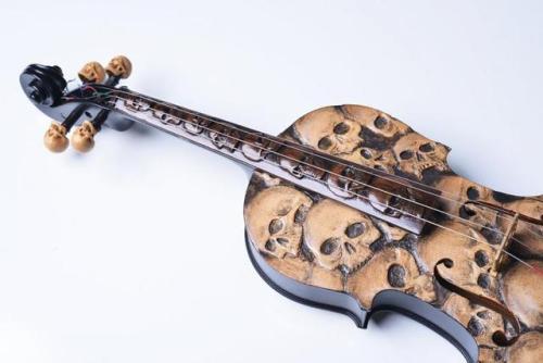 rotten-candy-art: silvarbelle: sixpenceee: This is a custom carved and painted violin. Link @popatoc