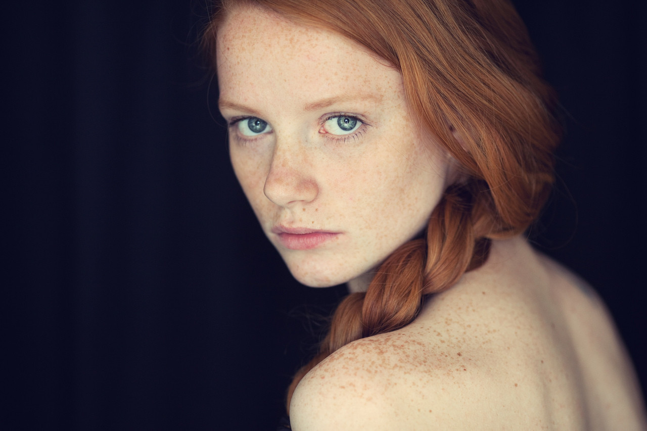 Cute teen girl redhead with freckles