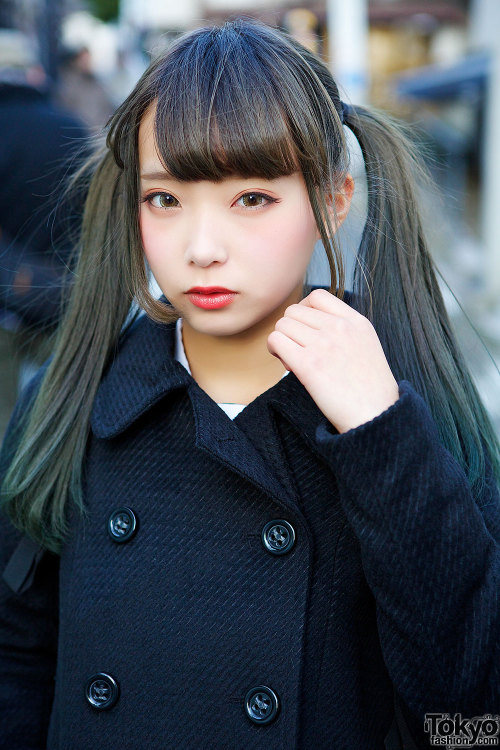 Twin Japanese sisters Mim (right, pink hair) and Mam (left, darker hair) on the street in Harajuku w