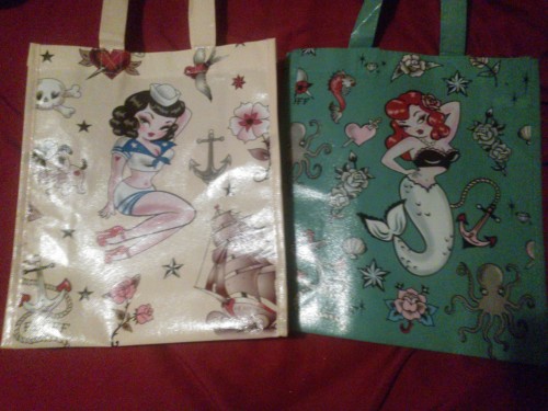 Guys look at the cute tote bags I got at Hot Topic. They’re only 4.50 and I got one of them half off because of the sale they had today. I love them :D