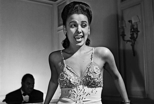 eccentricks:  Lena Horne performing in the lounge of the Savoy-Plaza Hotel, New York, 1942.