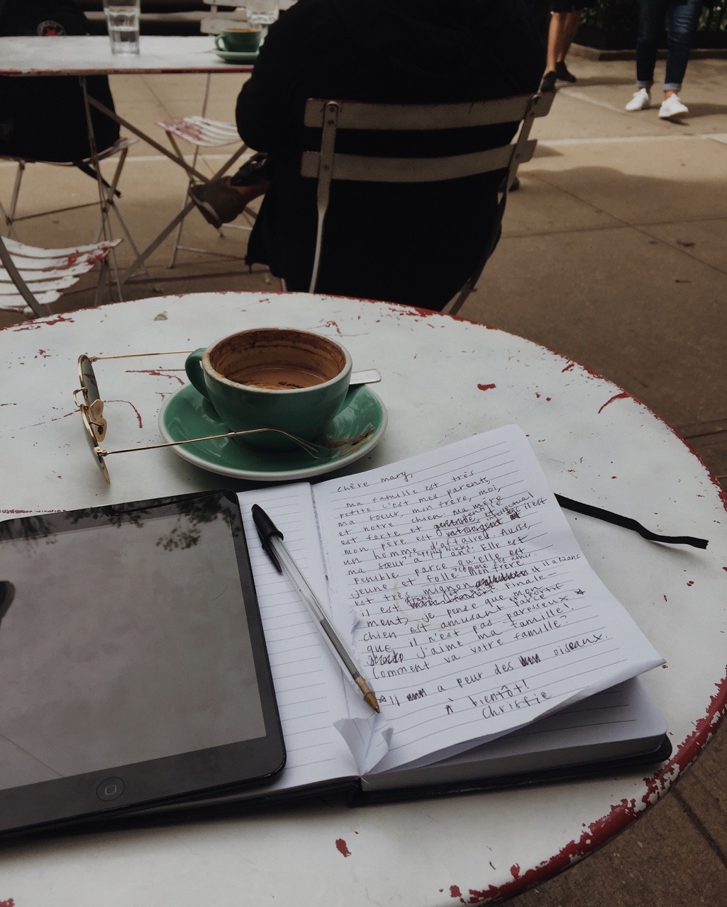 nycbambi:  French scribbles, company from a random pup, cappuccino, warm sun, daydreaming