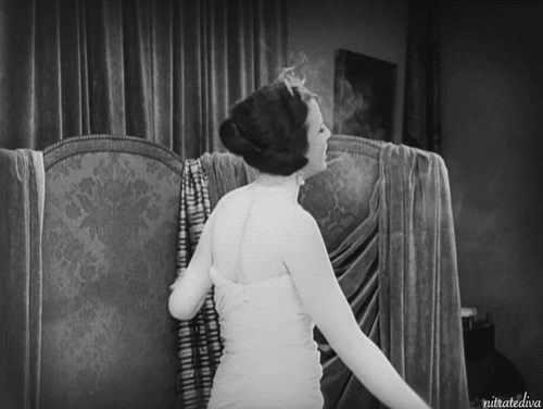 Bess Flowers, “queen of the dress extras,” in a risqué scene from A Woman of Paris (1923). #1920s#charlie chaplin #a woman of paris #bess flowers#silent film#silent movies#smoking#smoking gif#burlesque#glamour#retro#nostalgia#gif#classic film#old movies#classic movies#flapper#1920s style