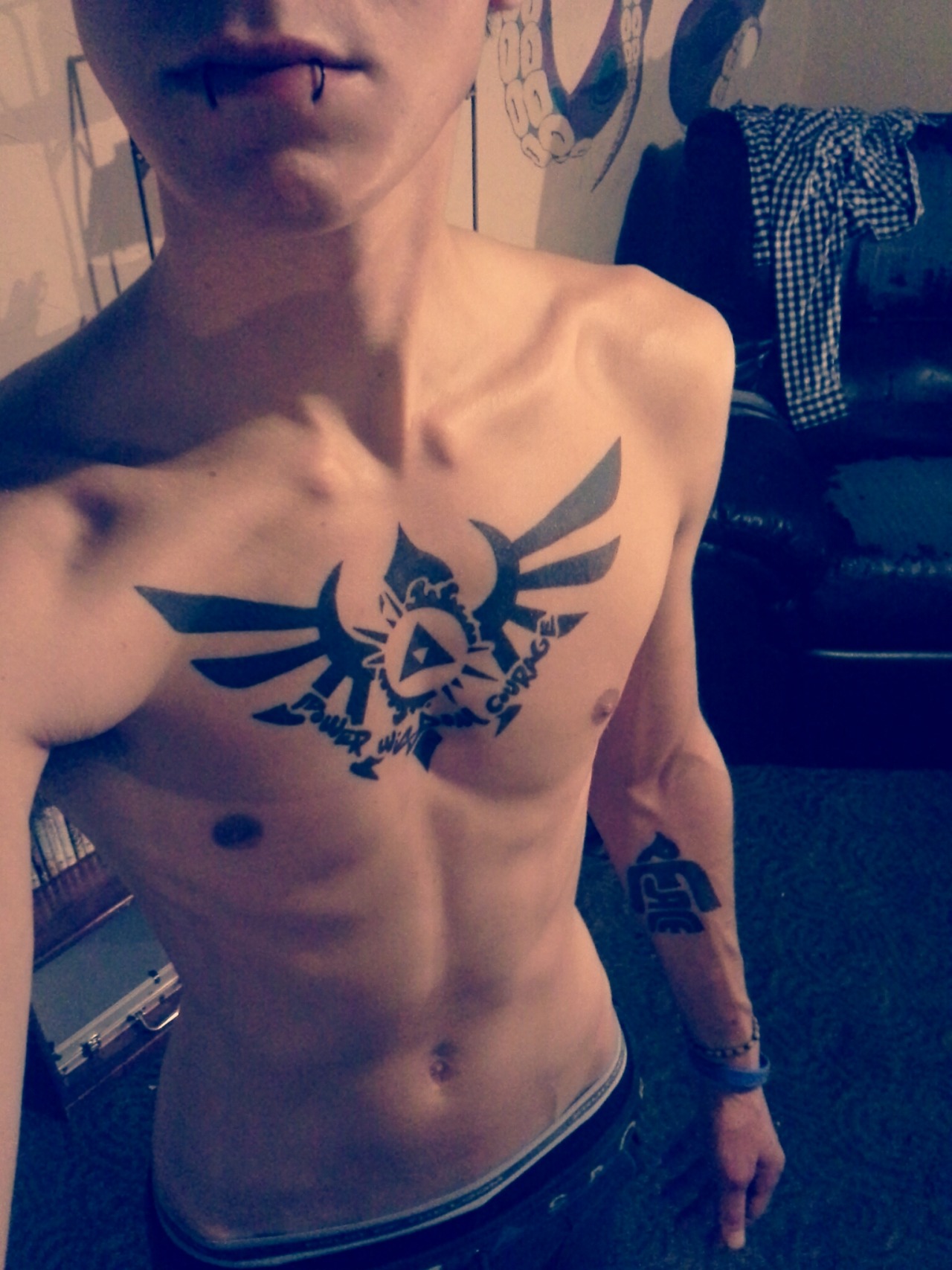 Triforce from Zelda with “Power, Wisdom and Courage” underneath. On my arm is the word “Peace” in the shape of a dove. Hope you like :)
submitted by http://caucaijon.tumblr.com