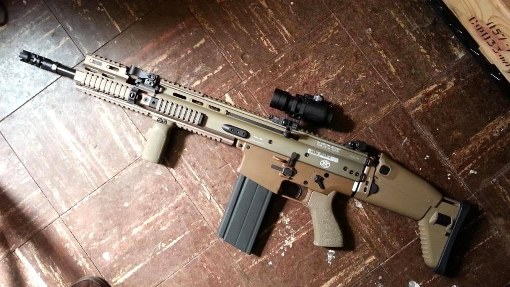 fmj556x45:  SCAR 17s with a modified 30 round FAL magazine.   This looks so sick!,