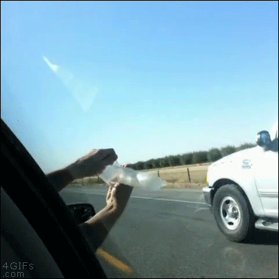 Holding a condom out a car window