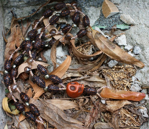 mnemosynejewels: Harvest. Howlite skull, aura quartz, seed pod, pyrite and andalusite necklace.