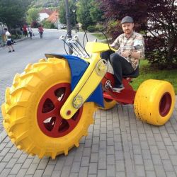 Archiemcphee:  Check Out Keith Schofield Sitting On This Incredibly Awesome Big Wheel.