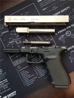 gunrunnerhell:  Breakdown Basic field stripped Gen 4 Glock 20. This one has been customized with a nickel boron finish on its slide and barrel. The guide rod might be an aftermarket model in stainless steel. Tempted to refinish my Gen 3 Glock 20 for a