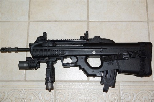 gunrunnerhell:  FN FS2000 The civilian model of the F2000, this 5.56x45/.223 bullpup consists of a largely polymer shell. Early models had an factory scope with housing that matched the overall aesthetics of the rifle. Current models ditch the scope and