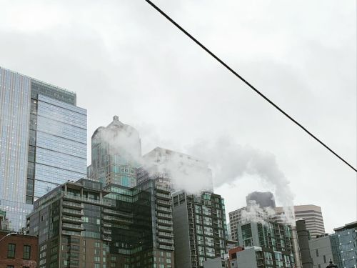 I found it strange to see a ribbon of smoke in the middle of all the skyscrapers. Maybe city dweller