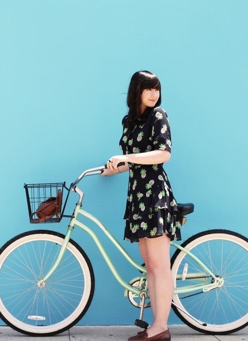 razumichin2:Cycle chic in black dress with pineapple printed and metallic green beach bike