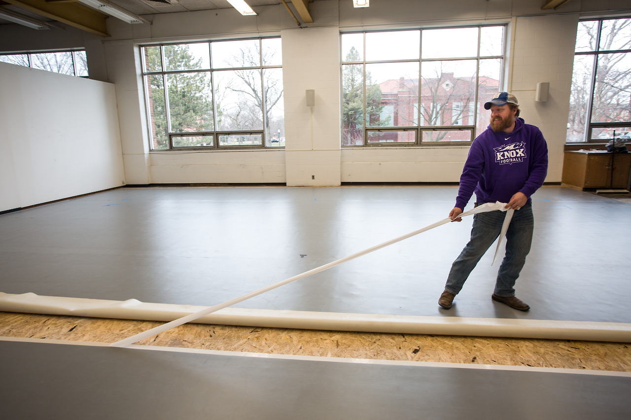 Dance moves: Knox College workers install flooring in the new dance studio space in Ford Center for the Fine Arts.