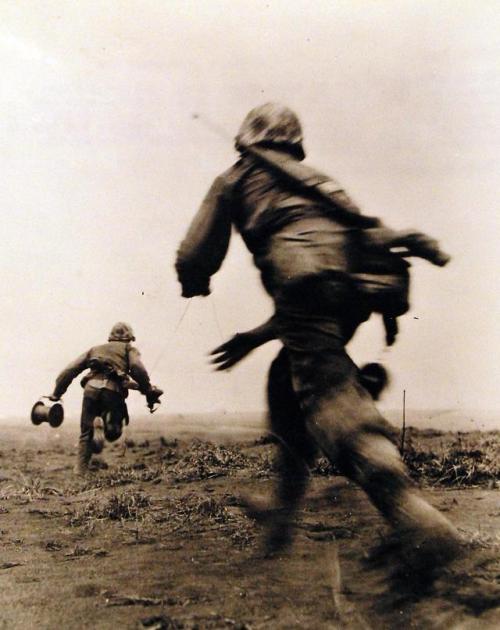 historicaltimes: Battle for Iwo Jima, February-March 1945. On Iwo Jima, two Marine wiremen of the Fi