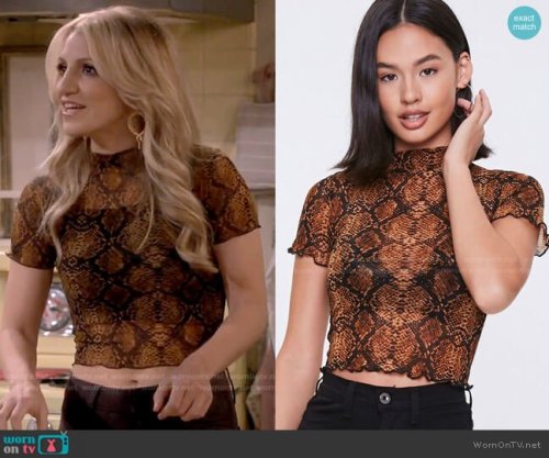 Gina’s mesh snake print top on B Positive Snakeskin Print Mock Neck Tee by Forever 21, $4 (was $9.9