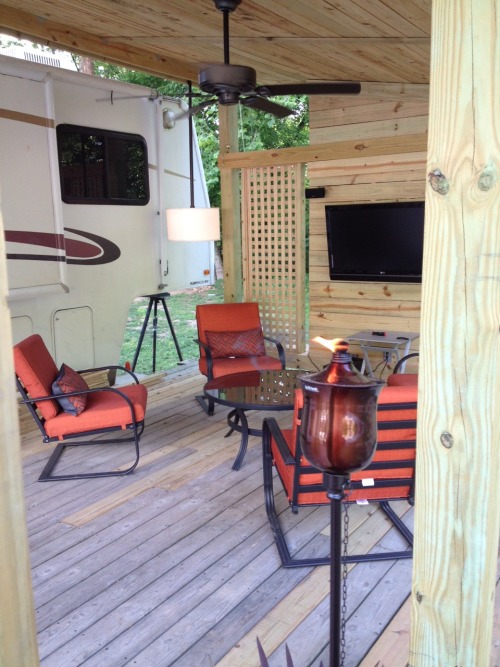 craftycub:  I’ve been helping Mike add on to his deck at the camper. The Deck was already there, but the two of us added the roof, and television wall, built the fire pit table and planter. Can’t wait to use it! :)