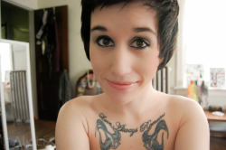 AlyLizXO poses self shot portrait style with her flawless skin, and beautiful eyes. 