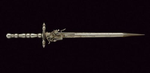 art-of-swords:  Combination Dagger with Flintlock Gun Dated: 19th century Culture: European Measurements: overall length 38.5 cm The dagger has a cusp of triangular section, assembled on a long neck of round section, faceted and octagonal at the base.