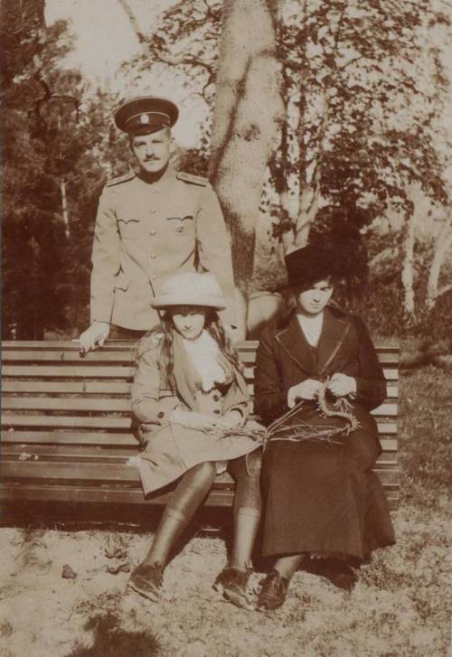 Grand Duchesses Anastasia and Olga Nikolaevna Romanov sitting on a bench 1914.