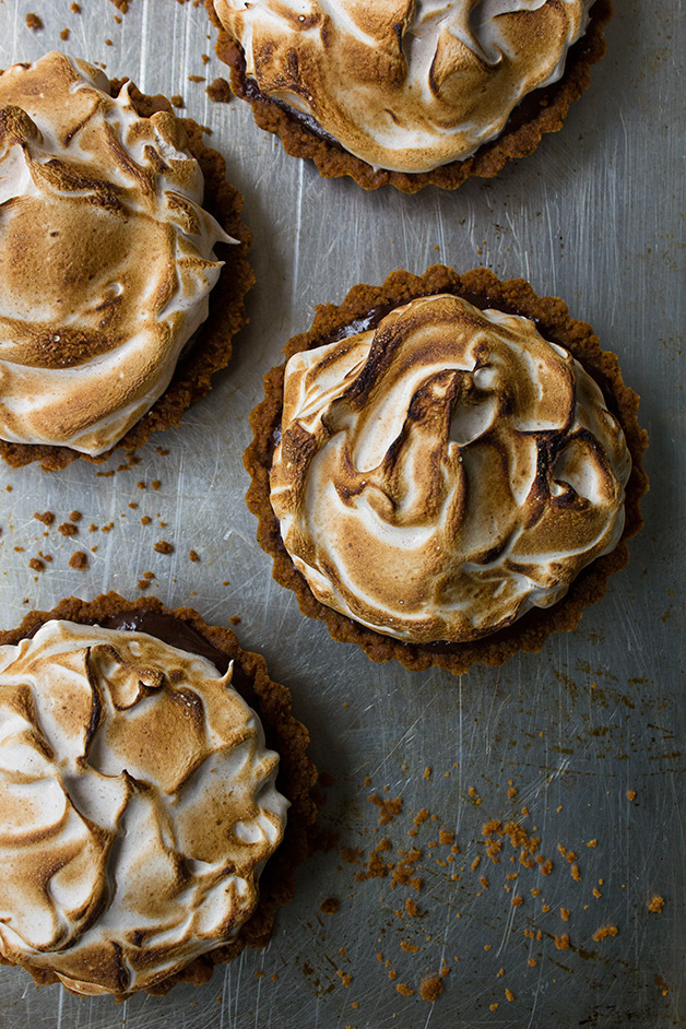 sweetoothgirl:    Boozy Chocolate Meringue Tartlets with Gingersnap Crust  