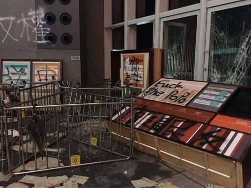 Anti-Police graffiti calling police ‘Dogs’ painted on the Legislative Council building in Hong Kong 