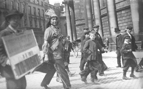 historium:Curious Irishmen and boys stare in awe at the sight of a visiting Native American. Dublin,