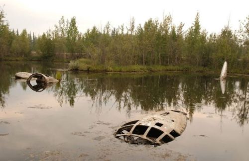 warhistoryonline:  Portions of a submerged B-29 bomber in Alaska remain visible above water http://wrhstol.com/16L2k2C 