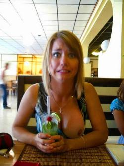 carelessinpublic:  Showing her big boobs and posing almost topless inside a restaurant