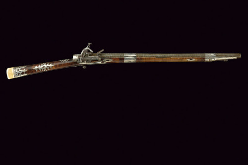 Ornate silver and ivory decorated miquelet carbine, originating from the Caucuses, 19th century.