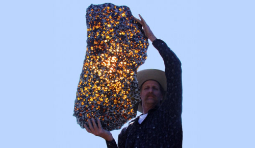 kittyconfessional:  sci-universe:  The Fukang meteorite, believed to be some 4.5 billion years old, was found near a town of the same name in China, in 2000. It is a pallasite, a type of meteorite with golden crystals of a mineral called olivine embedded