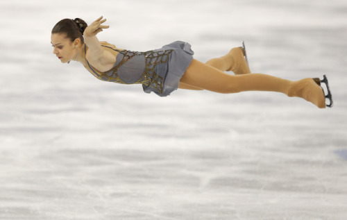 Adelina Sotnikova.Architectural gold blinging against a soft grey backdrop.One handed Beilmans. 