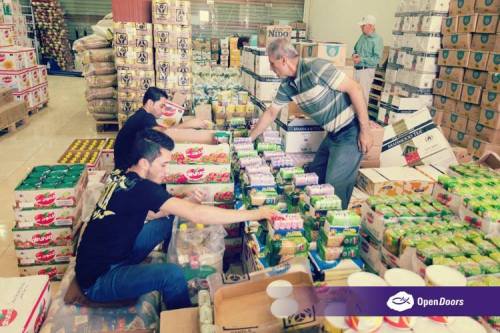 80 Iraqi refugees from Erbil have found employment preparing the food parcels that are distributed b